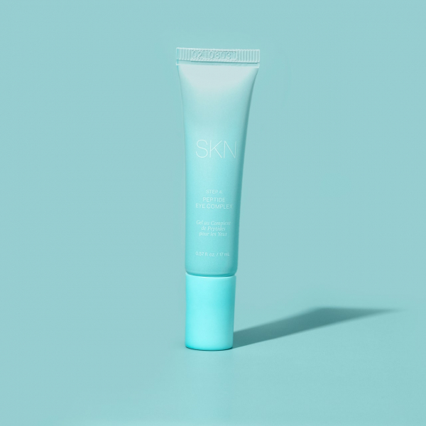 light blue tube of Lori Harvey Peptide Eye Complex on a light blue background